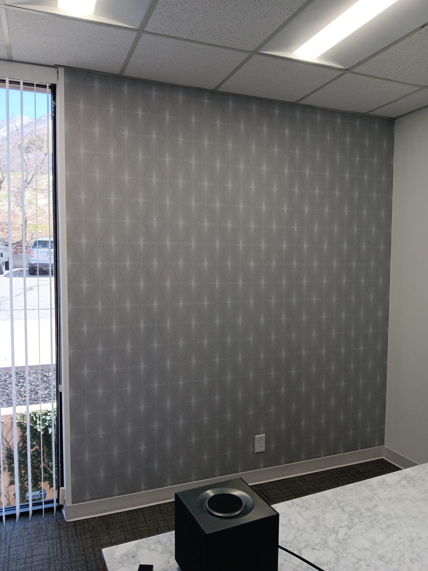 Modern office with geometric wallpaper