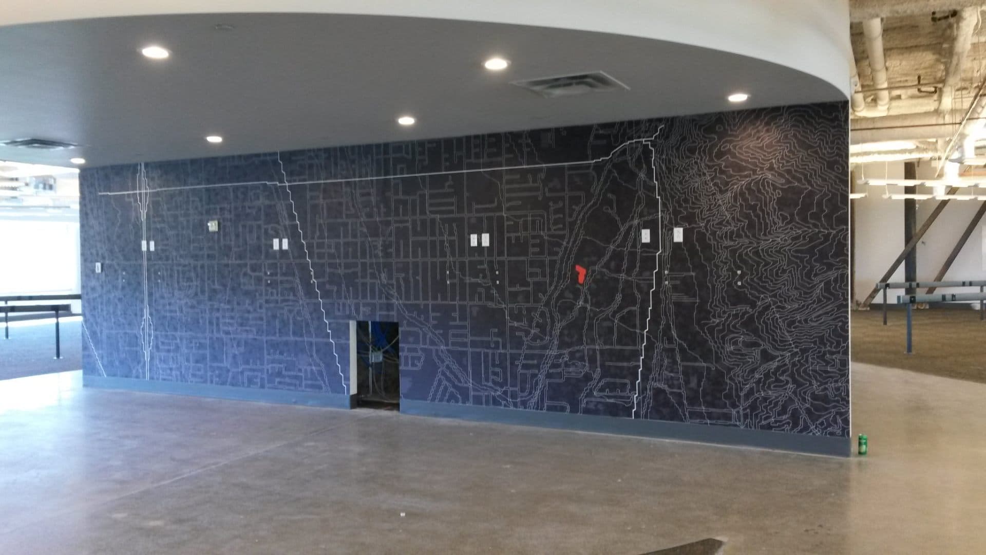 Office with topographic mural covering the wall