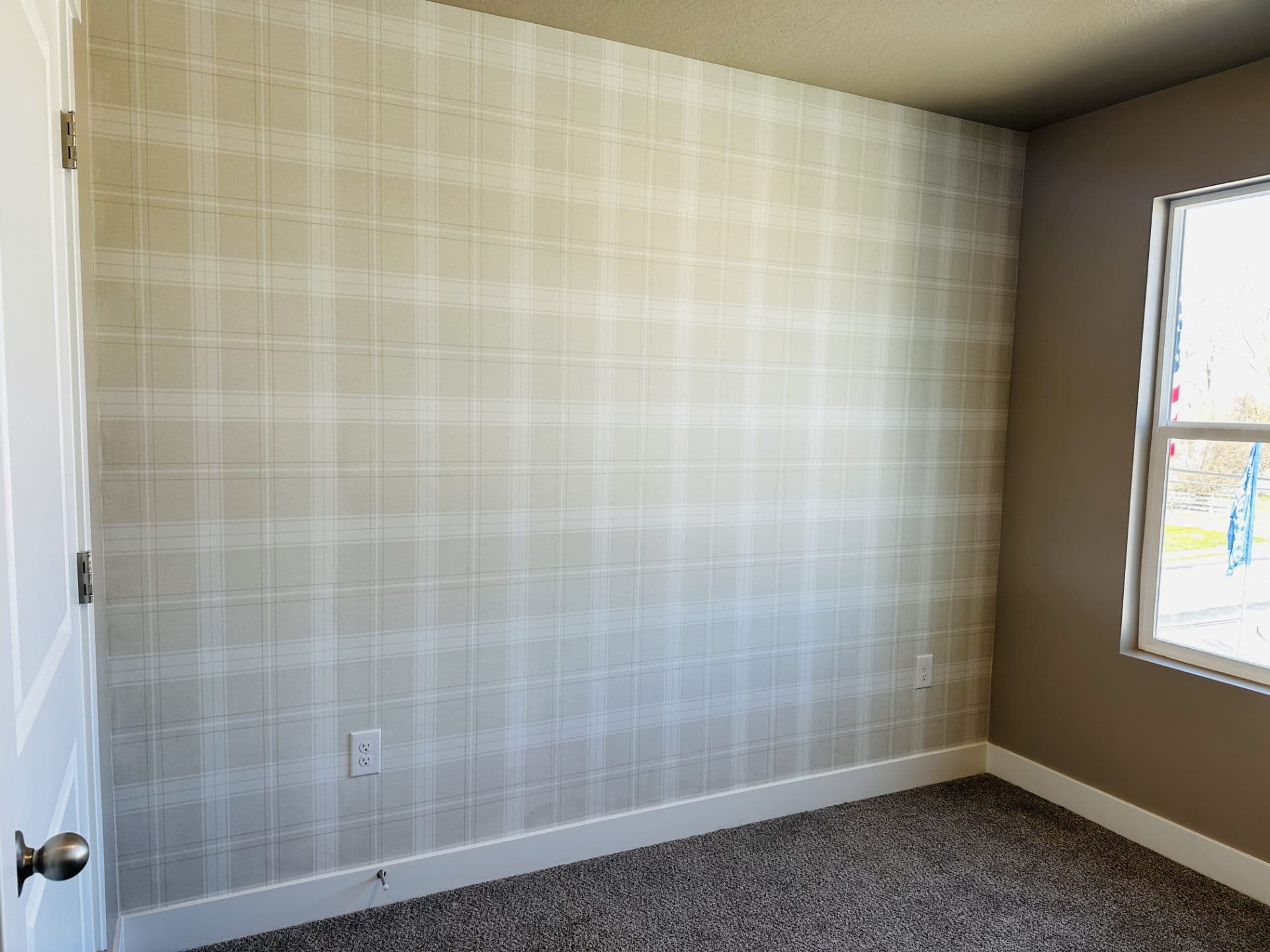 Bedroom with plaid wallpaper
