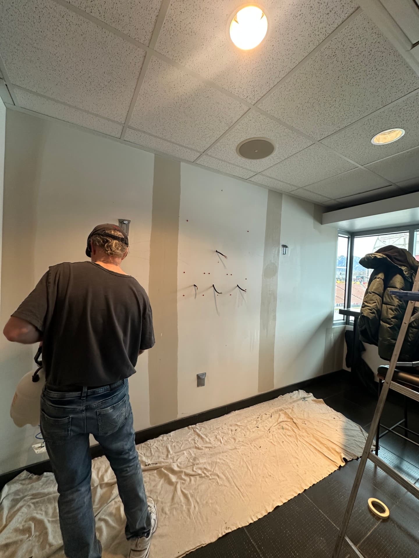 Drywall installation in progress during commercial build-out