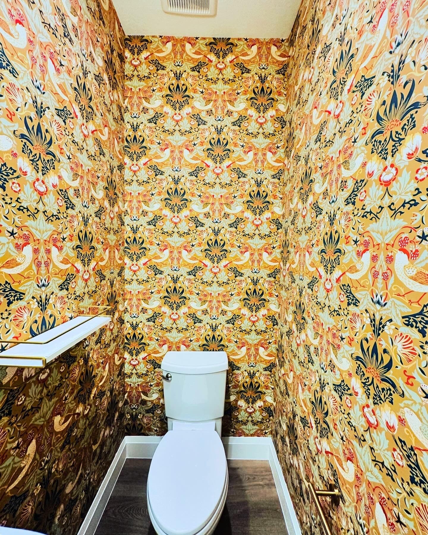 Bathroom with ornate floral wallpaper pattern matched seam to seam