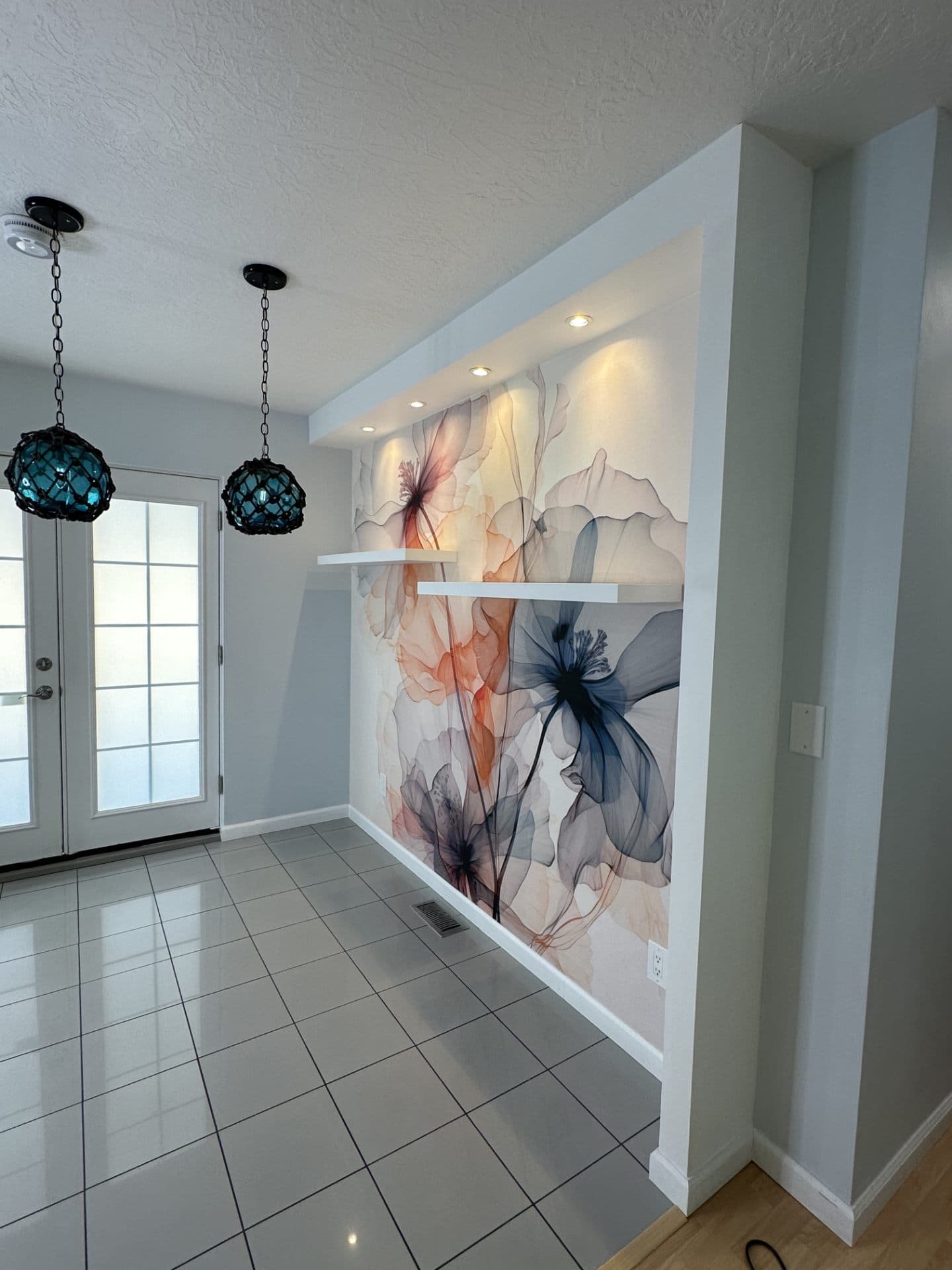 Entryway with floral wall art and pendant lighting