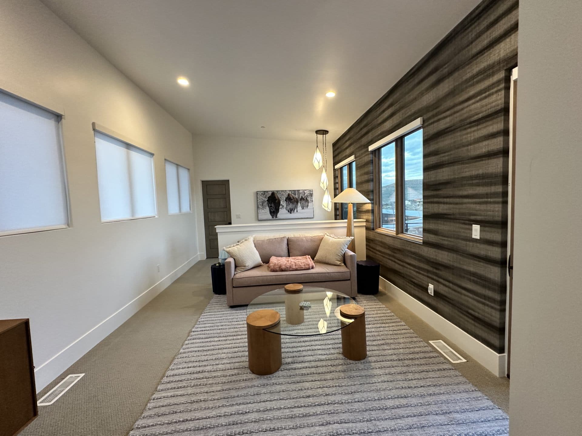 Modern living room with a warm wood accent wall